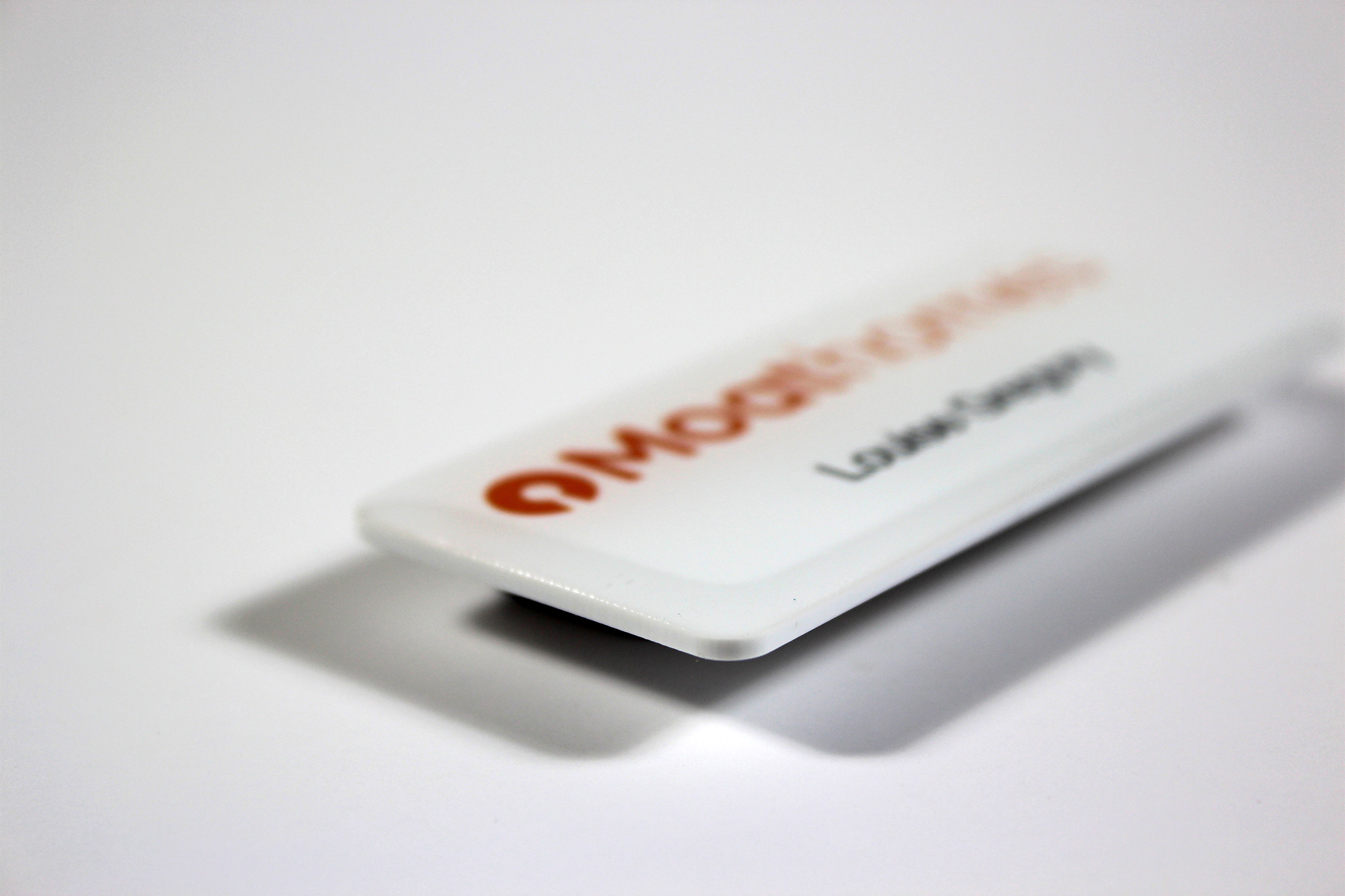 White magnetic name badge with corporate logo and name printed in colour for Moat homes