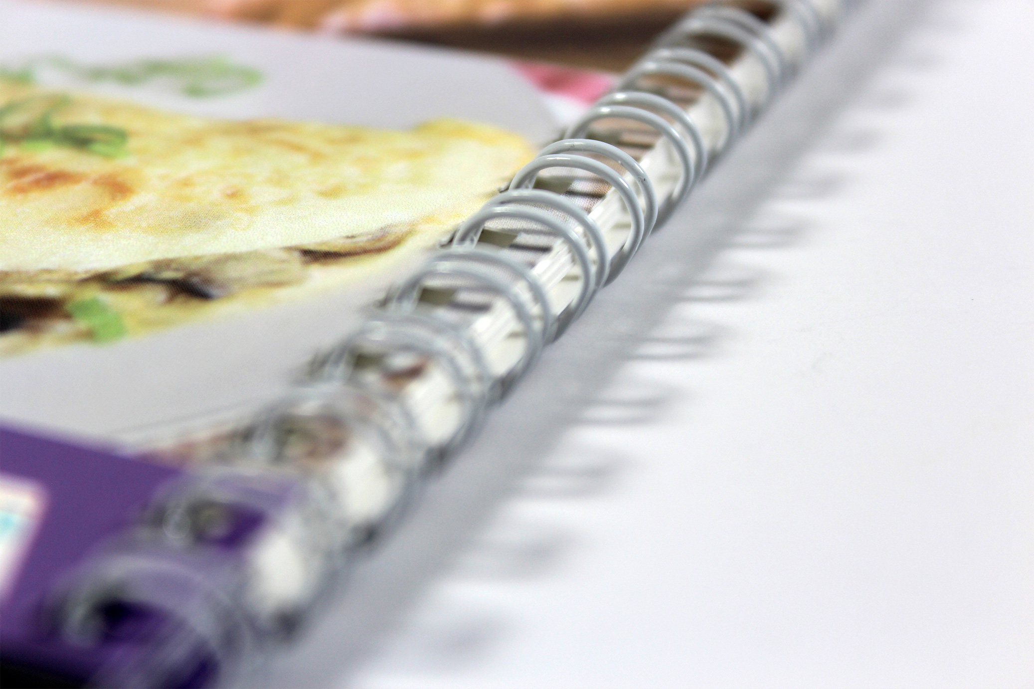 Printed Wiro-bound employee recipe book for MTR Cross Rail - close-up of binding